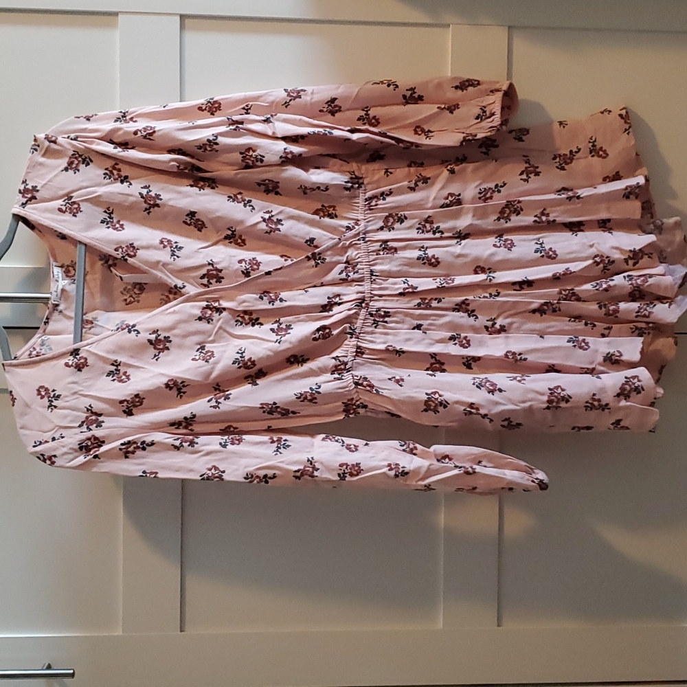 Pink long sleeve romper with pockets